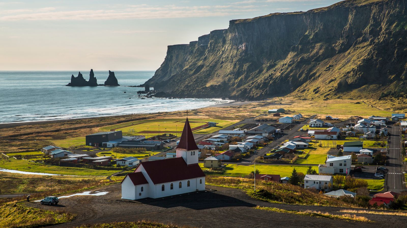  A view of Vik, Iceland, in August with Reynisdrangar sea stacks in the distance.