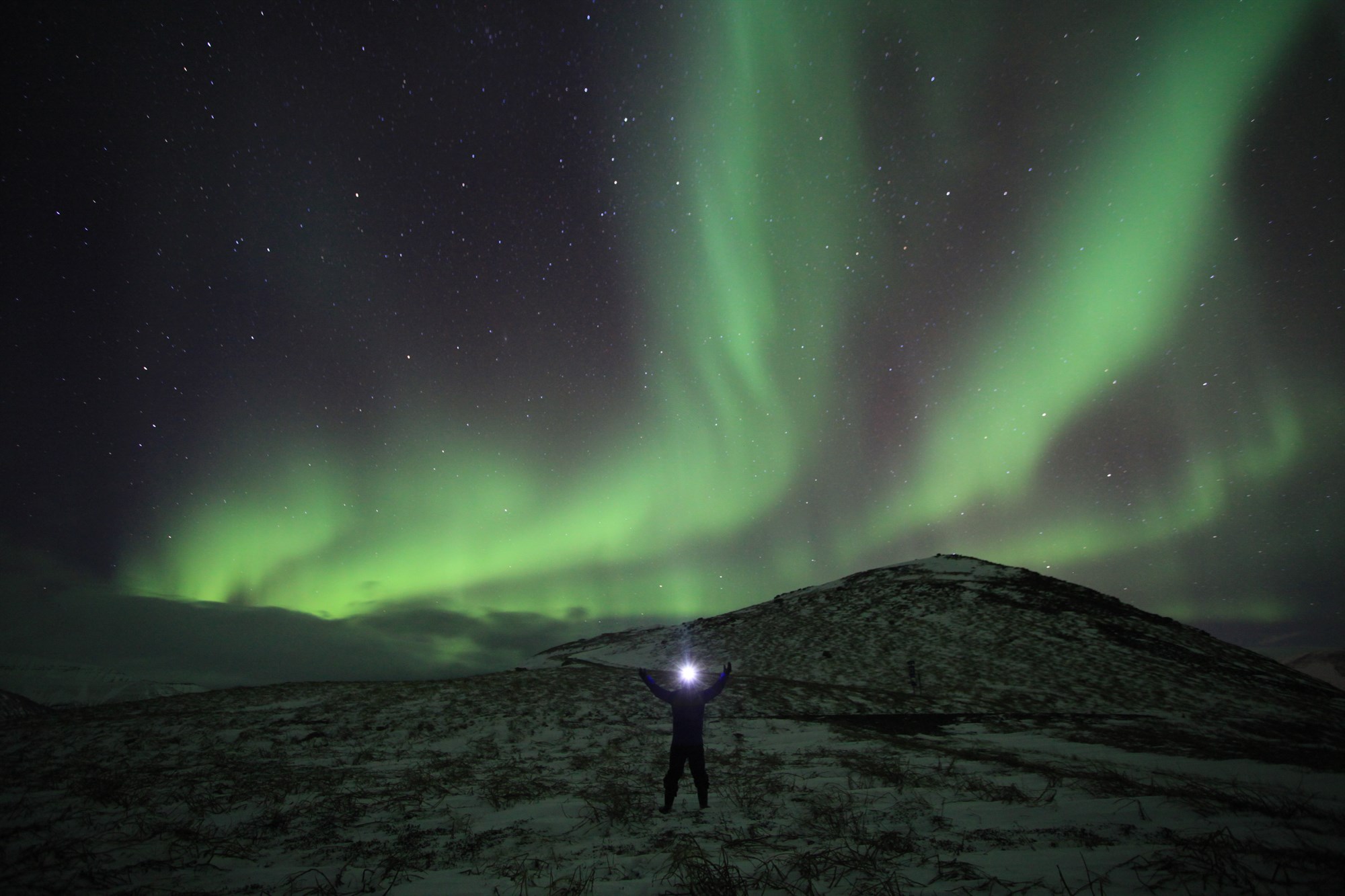 Northern Lights over Icelandic highlands with person