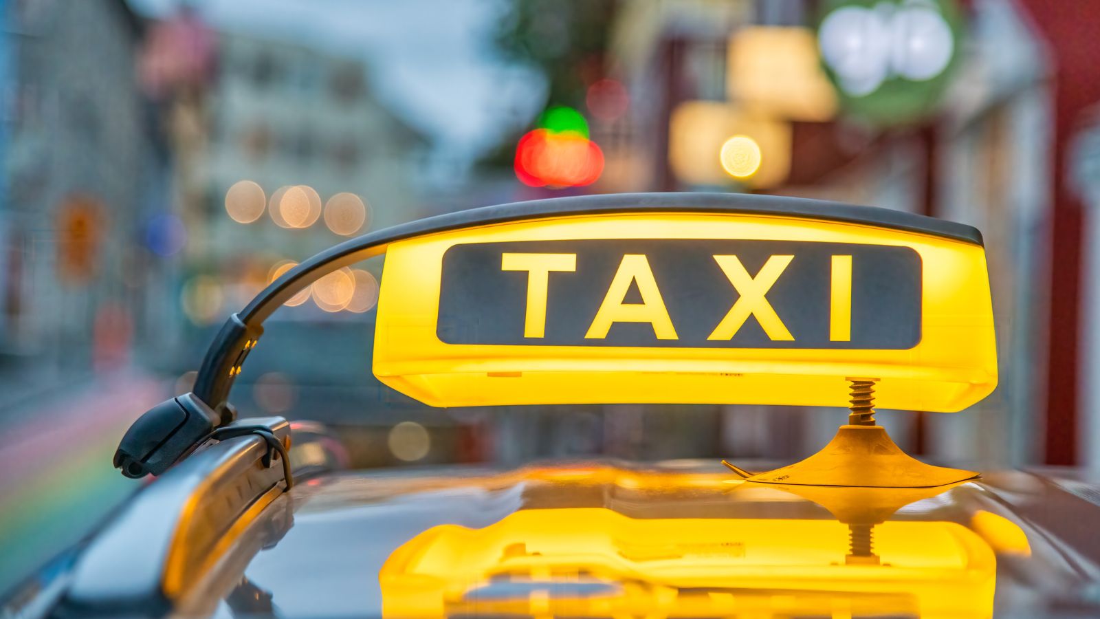 A lit-up taxi sign on a taxi in Reykjavík, Iceland.